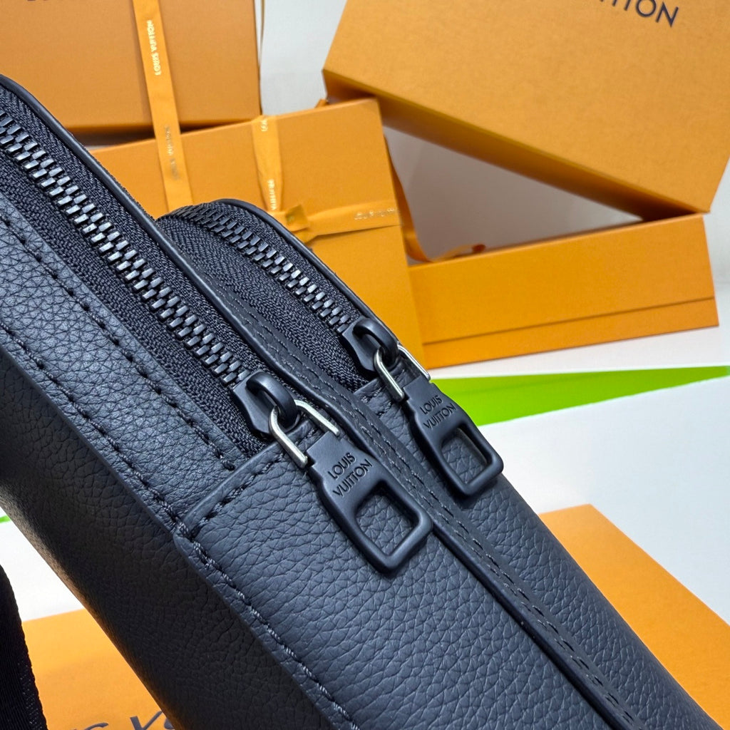 Men's Louis Vuitton crossbody bag close-up, dark blue double zipper with pull tabs