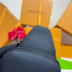 Louis Vuitton bag in dark blue grained leather, close-up of zipper track and stitched panel.