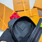 Men's Louis Vuitton crossbody bag close-up, open top showing dark lined interior pocket