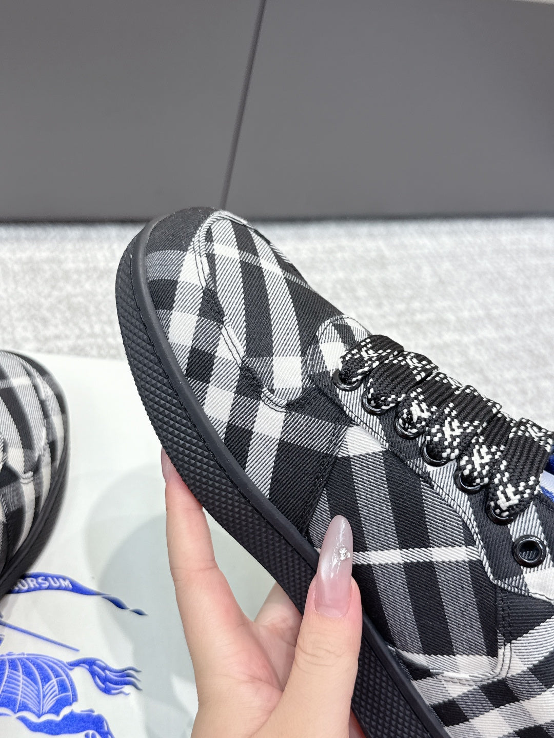 Check-pattern sneaker upper with blue interior lining and black rubber sole