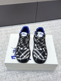 Check-pattern sneakers with blue lining, black laces, and textured rubber sole