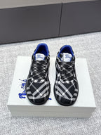 Check-pattern sneakers with blue lining, black laces, and textured rubber sole