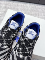 Front of check-pattern sneakers showing blue interior lining and lace-up