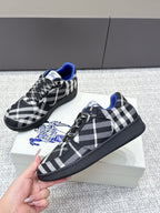Low-top check-pattern sneakers with blue accents and black lace-up closure