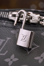 Padlock with Louis Vuitton logo on dark monogram canvas