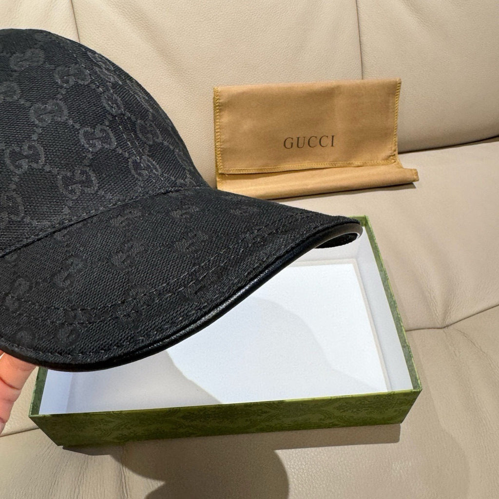 Black baseball cap with GG monogram pattern and curved brim