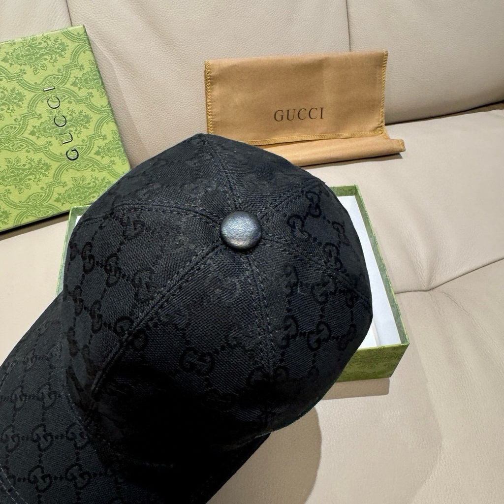 Black baseball cap with GG pattern and round top snap button