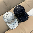Balenciaga caps set: one white and one dark navy, both with repeating BALENCIAGA logo.