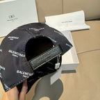 Burberry cap with dark adjustable strap and buckle; BALENCIAGA logo print