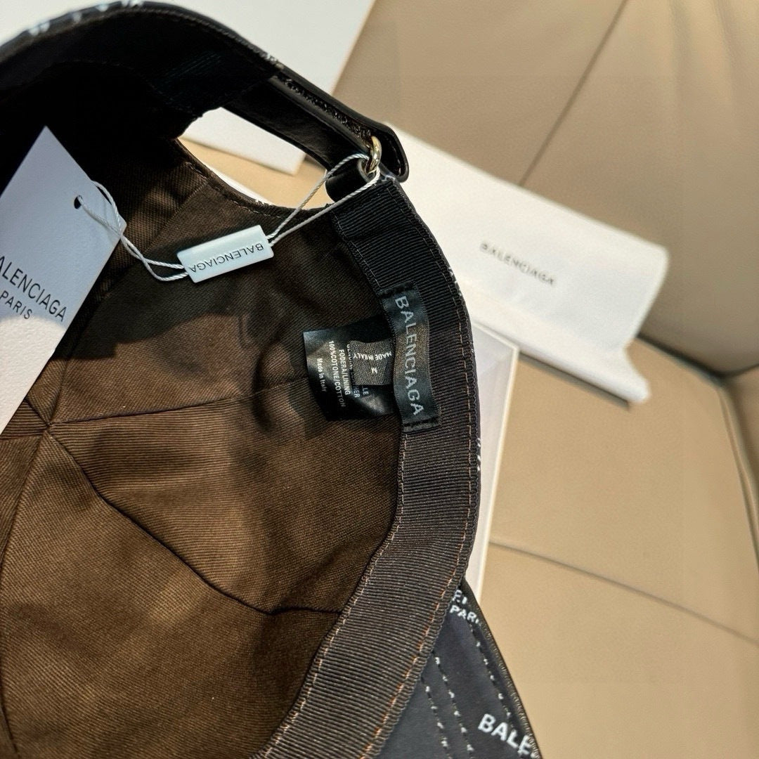 Burberry cap interior view with dark strap, metal buckle, and BALENCIAGA label