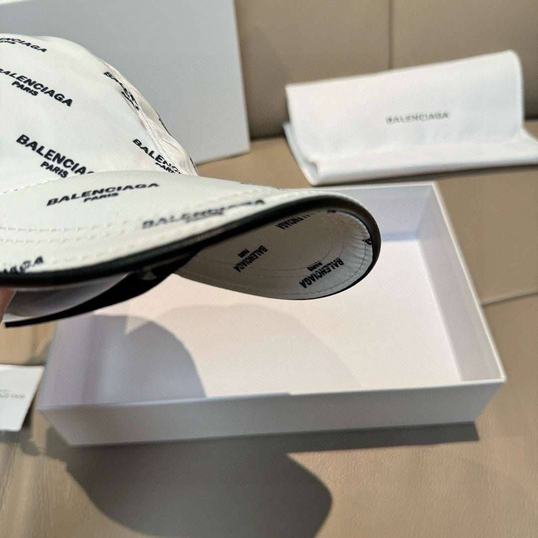White baseball cap brim underside with small logo text, showing inside panel