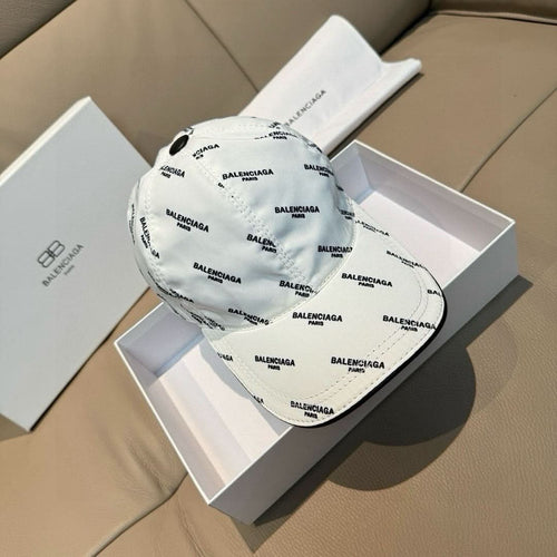 Balenciaga logo cap in white with allover print, curved brim side view