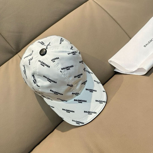 Balenciaga cap in white with allover BALENCIAGA print and round black button