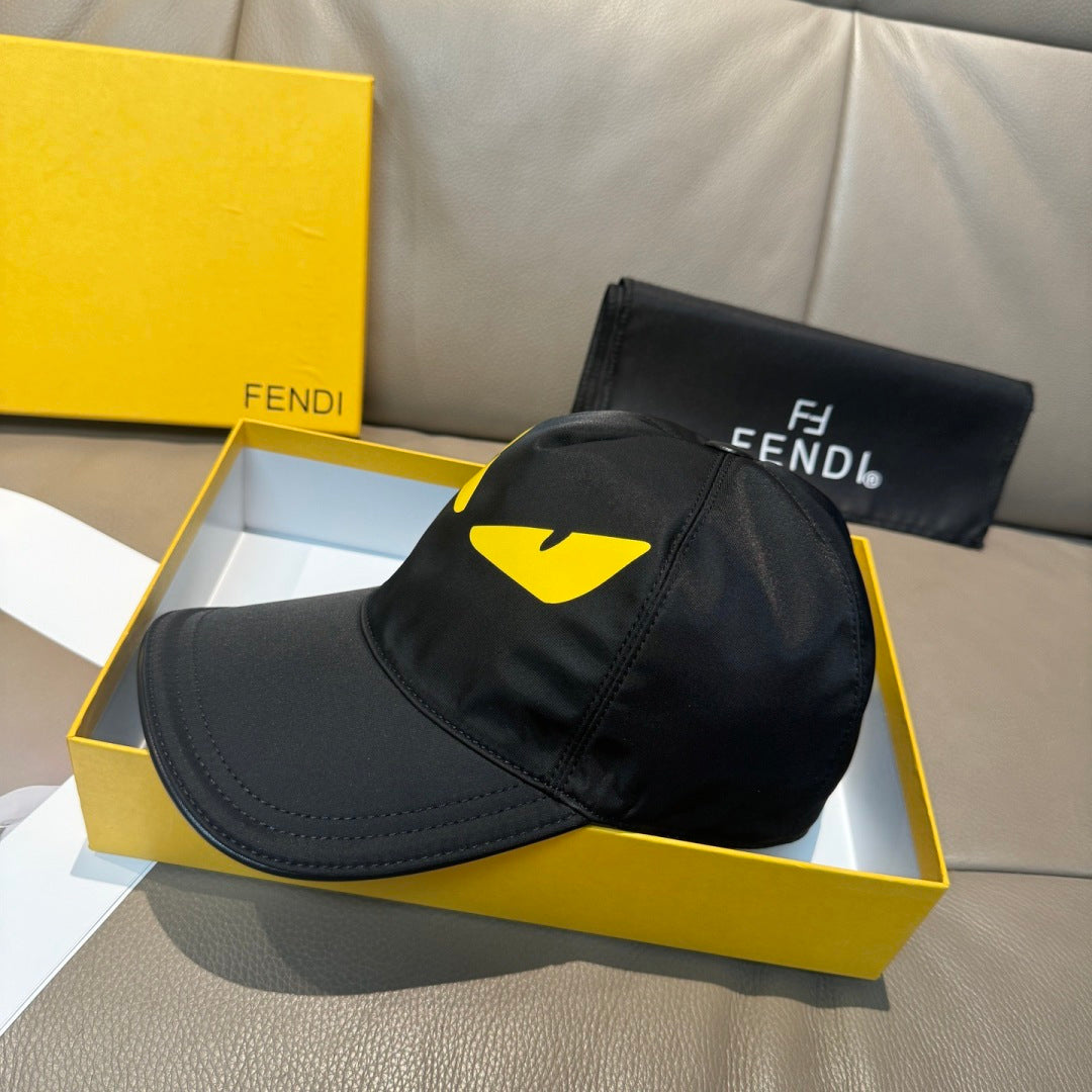 Fendi cap in black with yellow graphic on front panels and curved brim