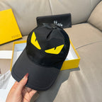 Fendi cap in black with yellow graphic on front crown