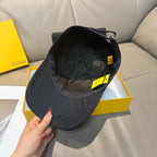 Fendi cap, black interior view with adjustable strap and hanging tags