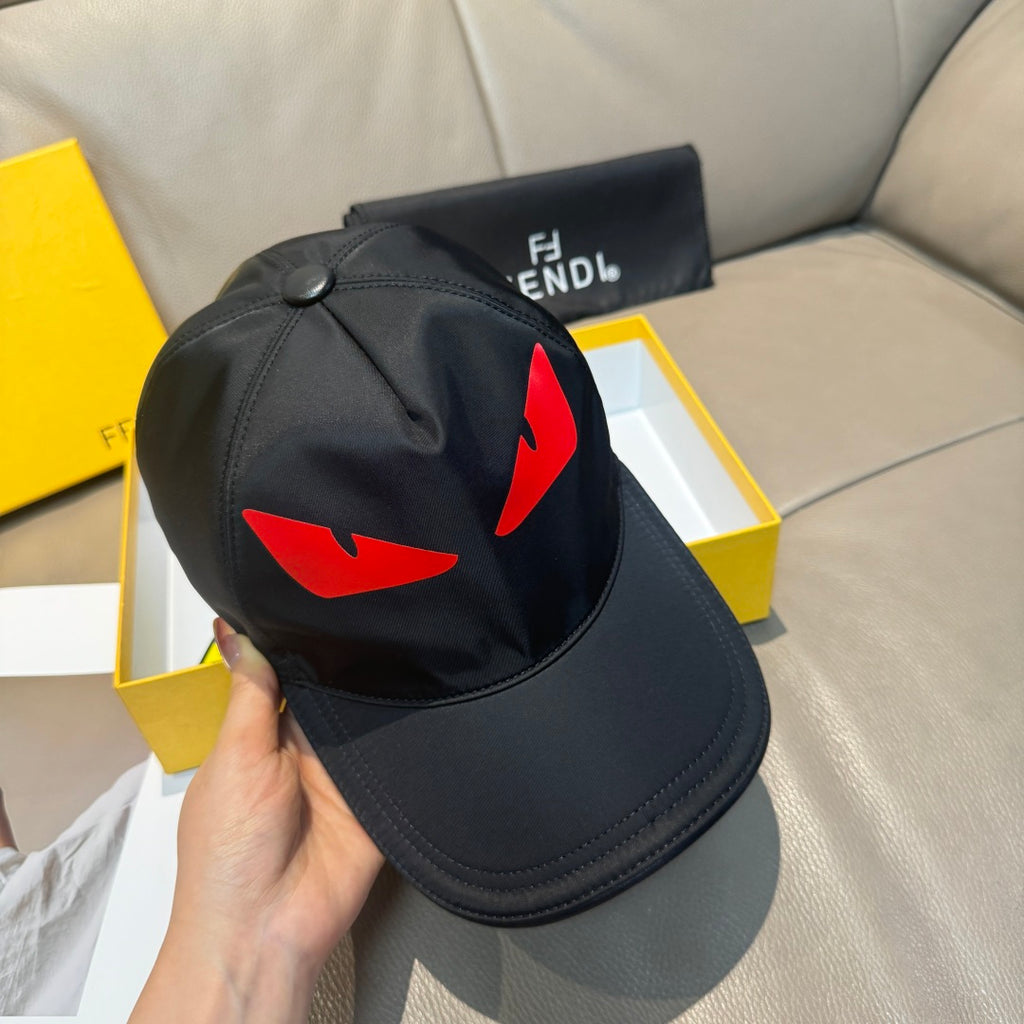 Fendi cap in black with red logo graphic and round button on top.