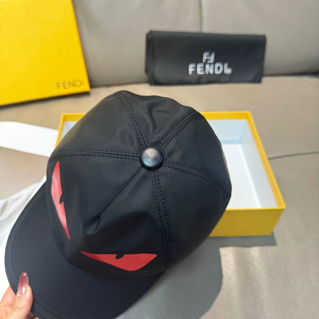 Fendi cap in black with red logo graphic and top button detail.