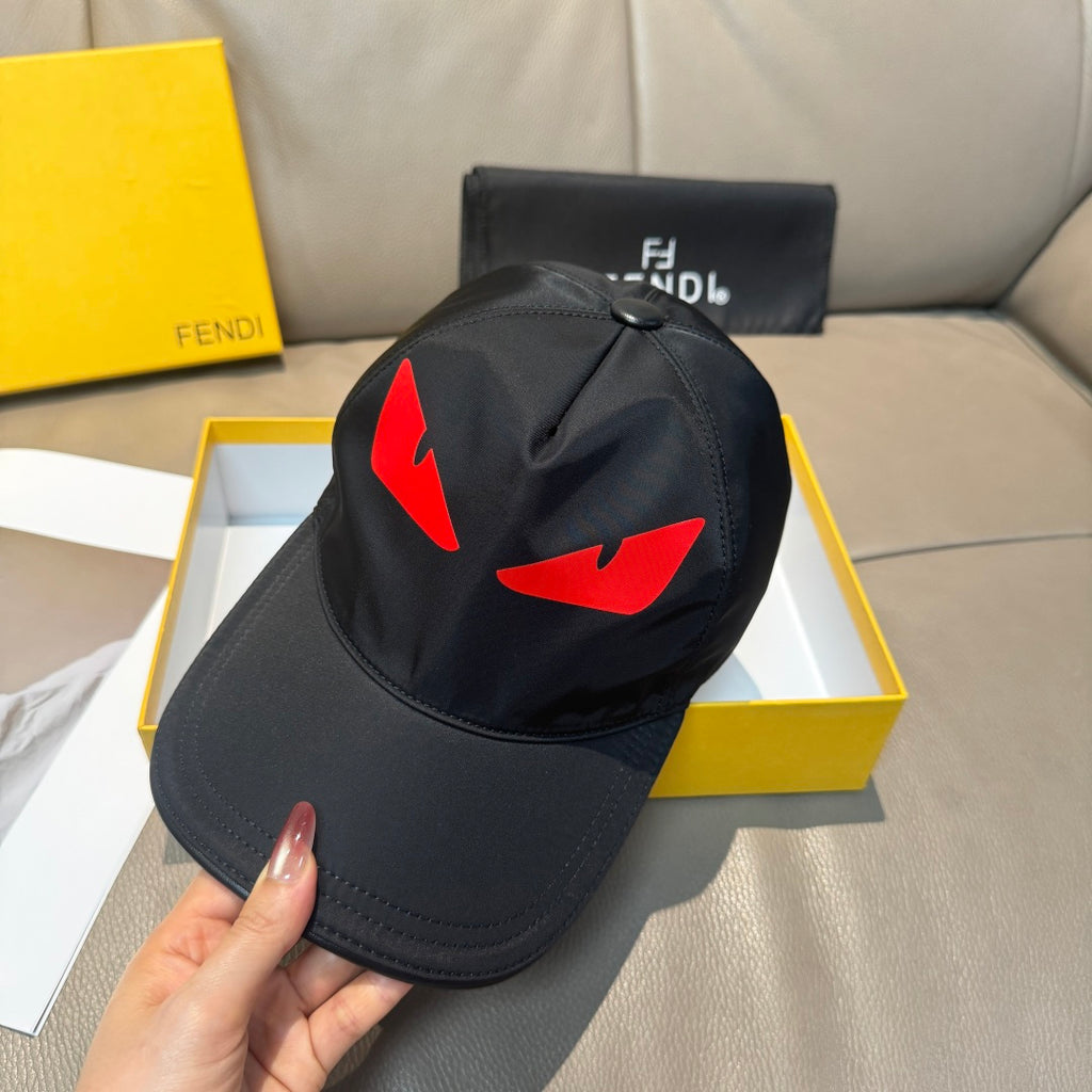 Fendi cap in black with red logo graphic and curved brim held in hand.