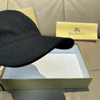 Dark baseball cap close-up of curved brim and stitched seam