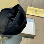 Dark baseball cap showing adjustable strap and metal buttons