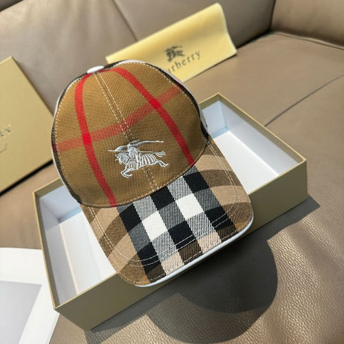 Burberry cap in tan, red, and black plaid with horse emblem on front.