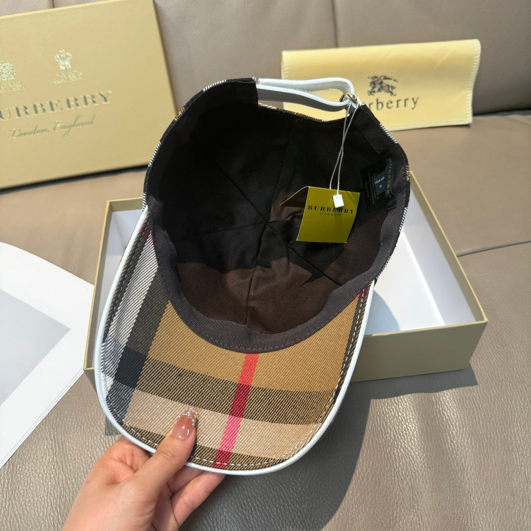 Burberry cap interior view with plaid brim and black inner lining.