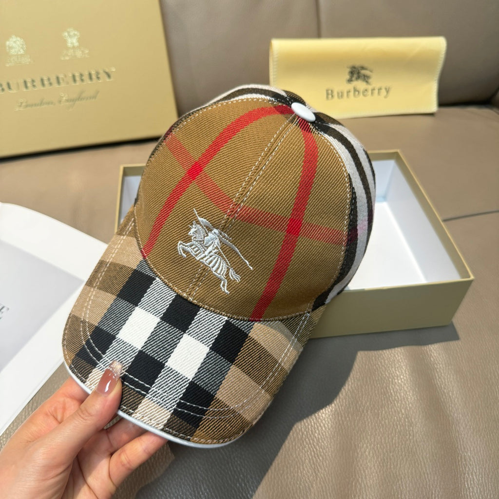 Burberry cap in tan plaid with horse emblem on the front panel.