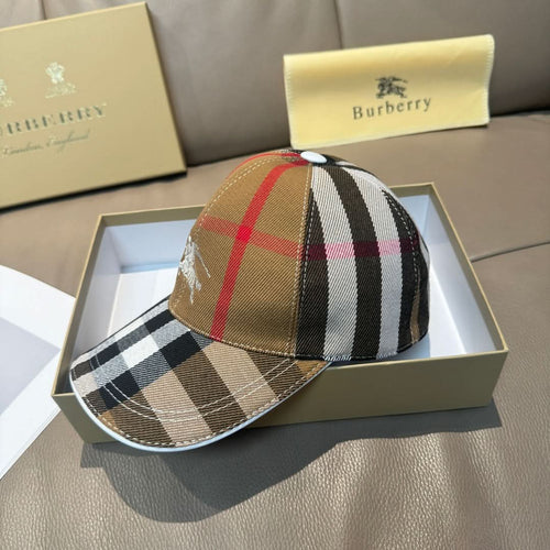 Burberry baseball cap with tan-and-black plaid crown and checkered brim.