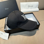 Black Dior baseball cap with white embroidered logo on side, curved brim