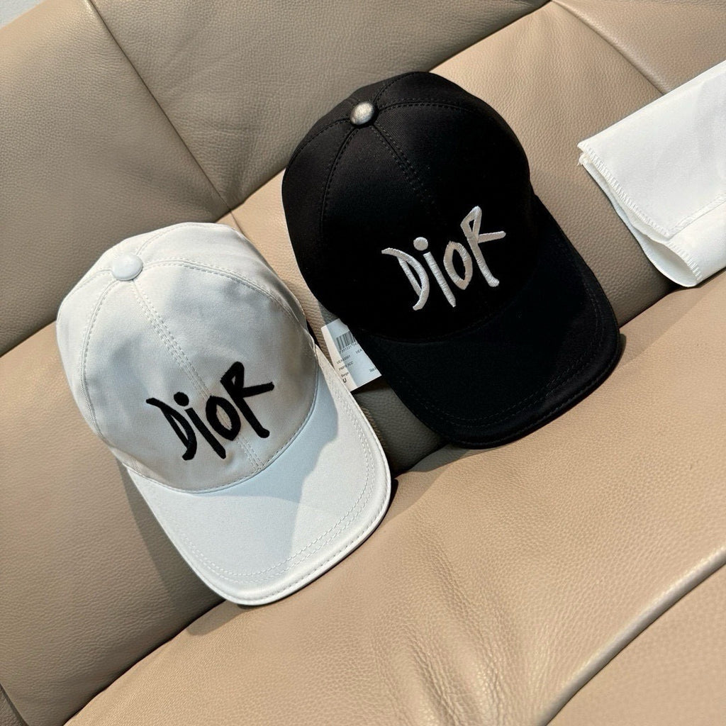 Black and white Dior caps with 'Dior' logo, curved brim and stitched crown.