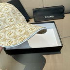 Beige monogram baseball cap showing underside of curved brim with white trim edging.