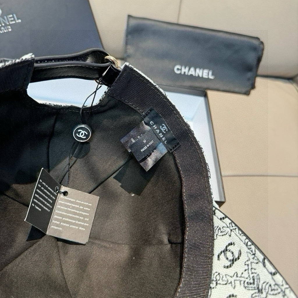 Chanel cap with black adjustable strap and fabric logo panel, tags attached
