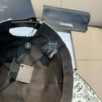 Chanel cap with black adjustable strap and fabric logo panel, tags attached
