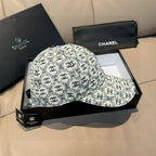 Chanel patterned cap in white with black logo print, curved brim