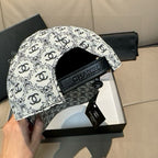 Chanel cap side view with black branded patch and adjustable strap