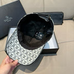 Chanel cap showing black interior lining and adjustable strap
