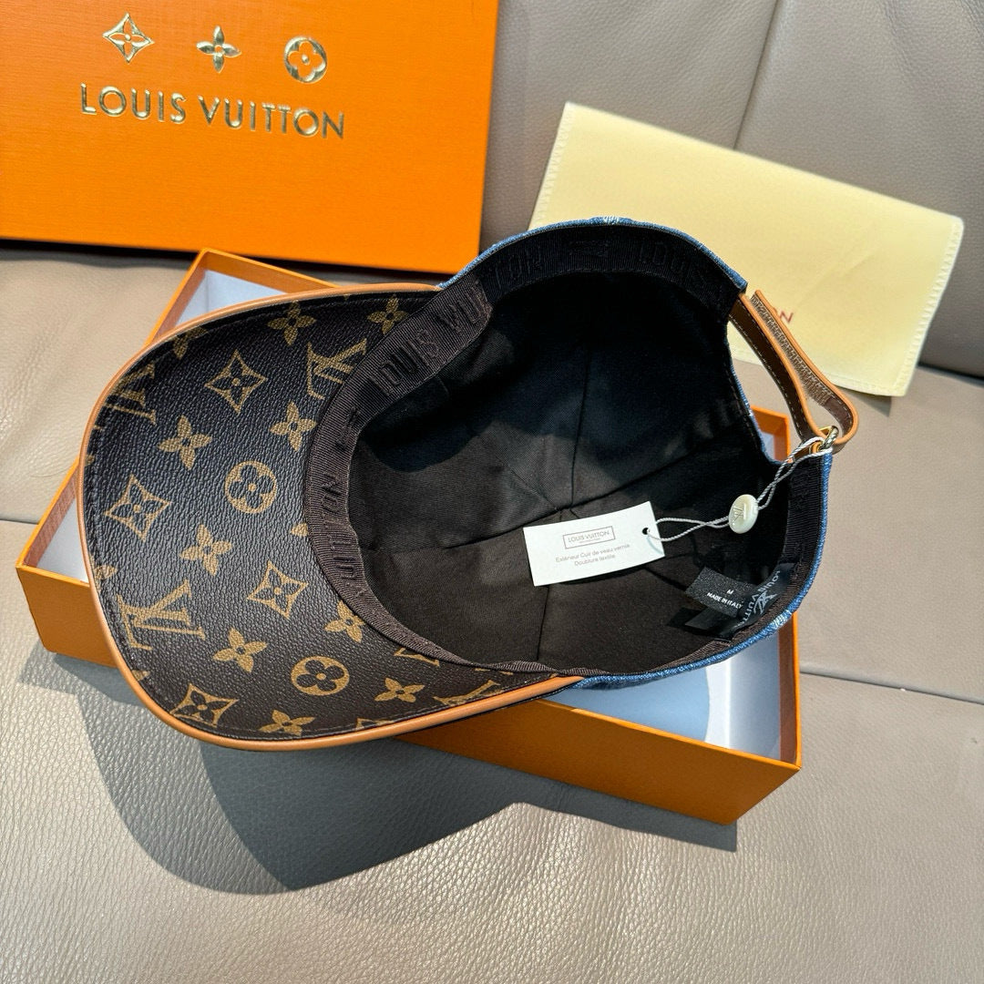 Black monogram baseball cap with dark interior, adjustable strap, and tags