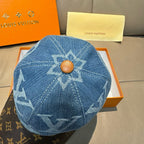 Blue denim baseball cap with starburst LV logo and tan button accent