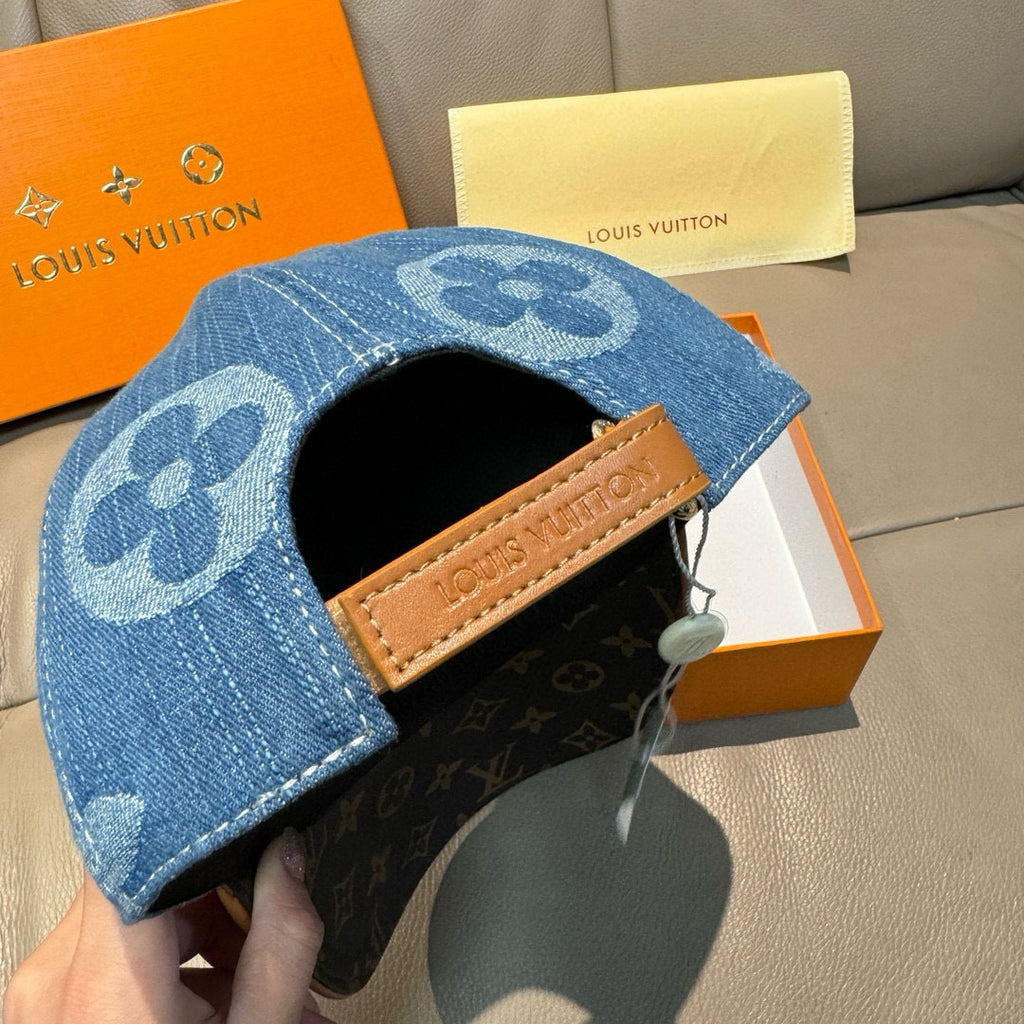 Blue denim baseball cap side view with brown LV leather patch and eyelet