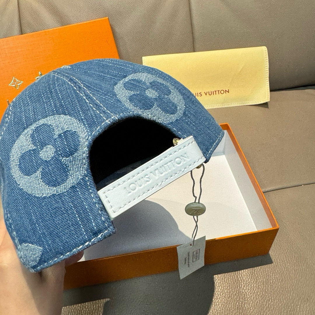 Louis Vuitton denim cap with blue monogram crown, open back and hanging tag