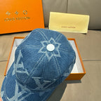 Louis Vuitton denim cap with large blue flower emblem and monogram pattern