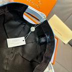 Louis Vuitton cap interior with black lining and adjustable strap with tag