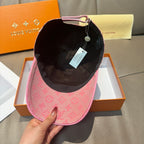 Louis Vuitton cap with pink exterior and black interior lining, curved brim.