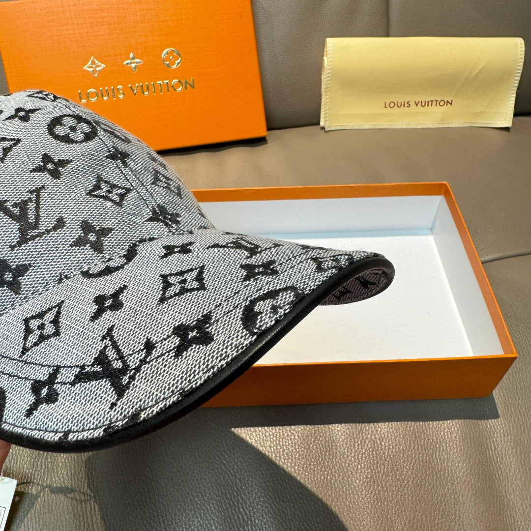 Louis Vuitton monogram cap, dark gray with repeating icons, brim side profile