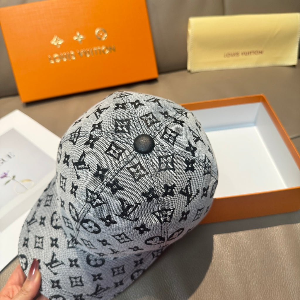 Louis Vuitton monogram cap in dark gray with round top button, front angled view