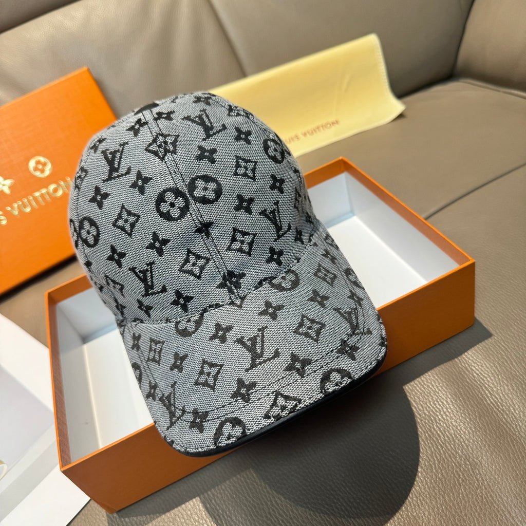 Louis Vuitton monogram cap in dark gray with repeating LV-style symbols