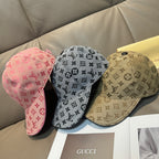 Louis Vuitton caps set: pink, black, and tan monogram baseball caps with curved brims.