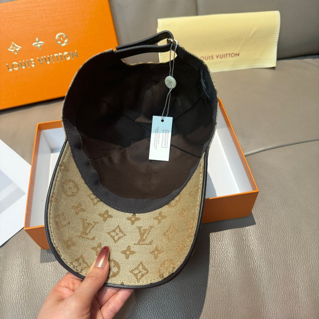Louis Vuitton monogram baseball cap with tan exterior and black interior, tag attached