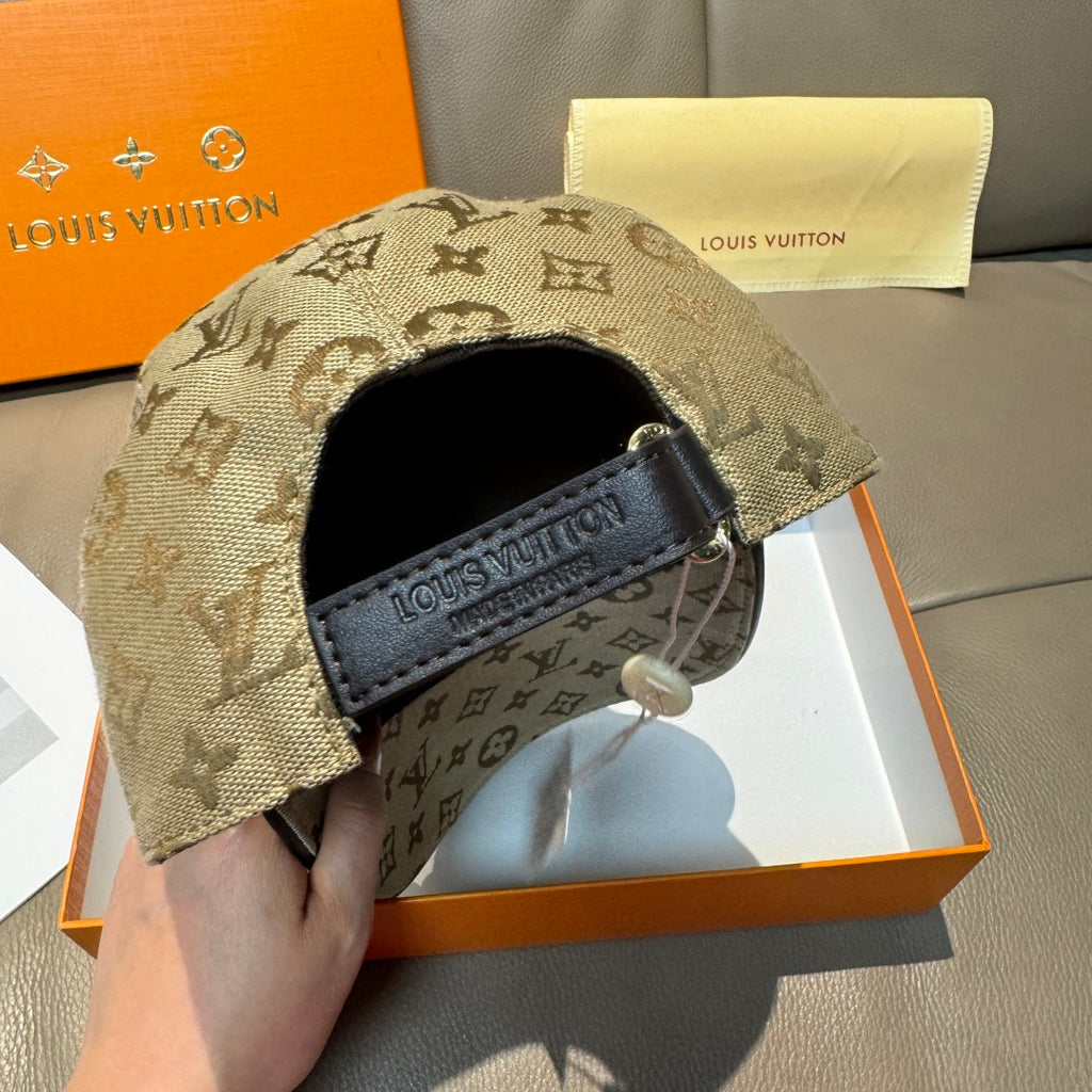 Louis Vuitton monogram baseball cap with tan pattern and black logo patch on side